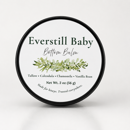 Everstill Baby Bottom Balm black tin with botanical label on light neutral background
