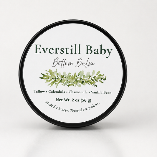 Everstill Baby Bottom Balm black tin with botanical label on light neutral background

