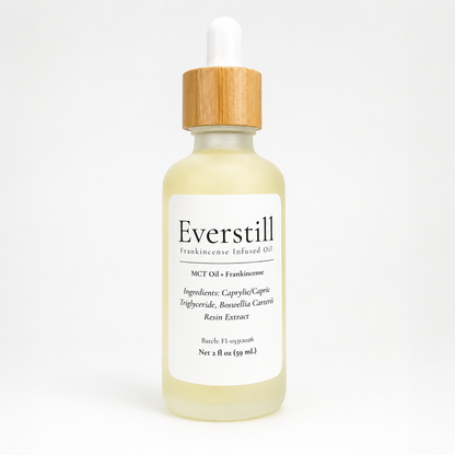 Everstill Frankincense Infused Oil featuring frankincense resin extract in MCT oil, presented in a frosted glass dropper bottle with bamboo cap.