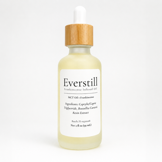 Everstill Frankincense Infused Oil featuring frankincense resin extract in MCT oil, presented in a frosted glass dropper bottle with bamboo cap.